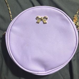 Purple purse with gold accents